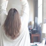 woman in white long sleeve shirt