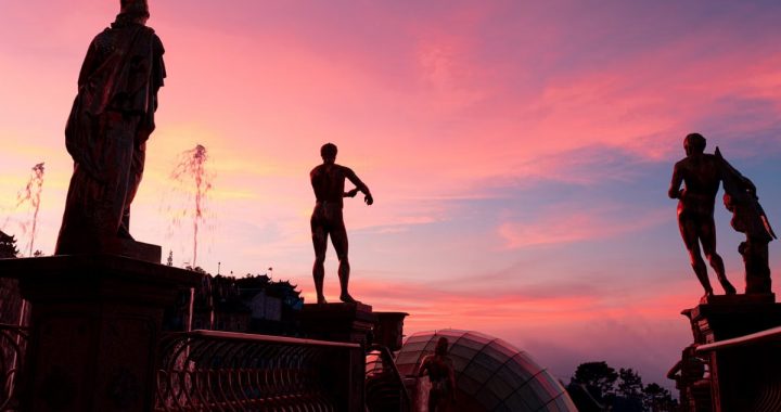 Majestic statue silhouettes against a vibrant sunset sky in Đà Nẵng, Vietnam.